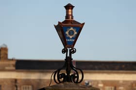 The Garda logo on a lamp at the entrance to Garda Headquarters in the Phoenix Park, Dublin