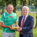 Keady Michael Dwyers GAA club chairman Patrick Óg Nugent and Fearghal McKinney, head of BHF NI