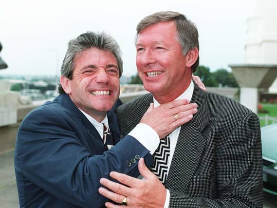 Newcastle boss Kevin Keegan (left) gets to grips with Manchester United manager Alex Ferguson as they meet at Wembley