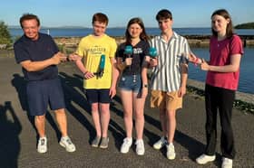 Students from Gortnor Abbey secondary school helping Marty Morrisey with his report for RTÉ Six One news. 