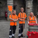 Jane Meagher with two street cleaners