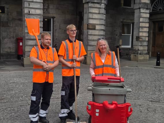 Jane Meagher with two street cleaners