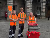 Jane Meagher with two street cleaners