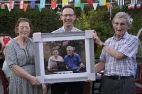 Oliver Nally (centre), newly elected Chairperson of the Ballymahon Twinning Group, presenting Breege and Tommy Murray with a specially commissioned portrait photograph of themselves during the Bastille Day celebrations in Ballagh, Mullingar