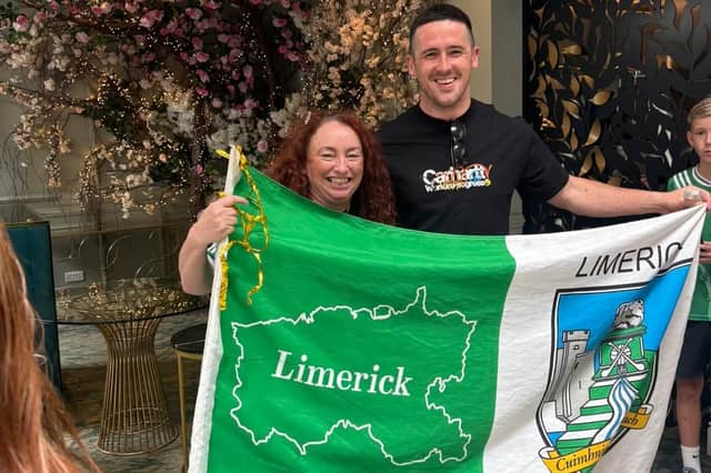 Limerick hurler Darragh O'Donovan reunites with famous flag and it's owner, Kathleen Delaney. PICTURE: Facebook