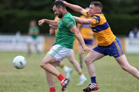 Colmcille match winner Barry McKeon attempts to get his shot off despite the close attention of Carrickedmond defender Dermot Brady during Friday's Peter Hanley Motors Longford Senior Football Championship Group B - Round 2 contest  in Emmet Park, Killoe. 