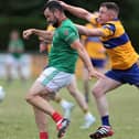 Colmcille match winner Barry McKeon attempts to get his shot off despite the close attention of Carrickedmond defender Dermot Brady during Friday's Peter Hanley Motors Longford Senior Football Championship Group B - Round 2 contest  in Emmet Park, Killoe. 