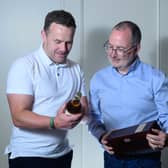 Mayo senior football manager Andy Moran is presented with a rare bottle of Knappogue Castle 1951 Irish whiskey by Gary McLoughlin, Chief Marketing Officer of Cobblestone Brands, during Mayo’s All-Ireland homecoming celebrations in Westport. 