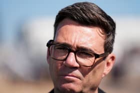 Prime Minister Andy Burnham looks at the camera