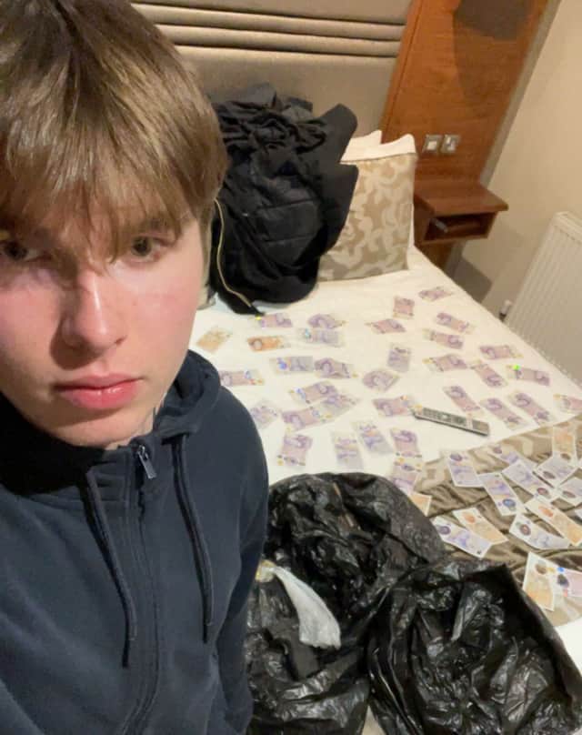 Johannes Natland, 19, with £2,000 in cash spread over a bed. (Counter Terrorism Policing/PA)