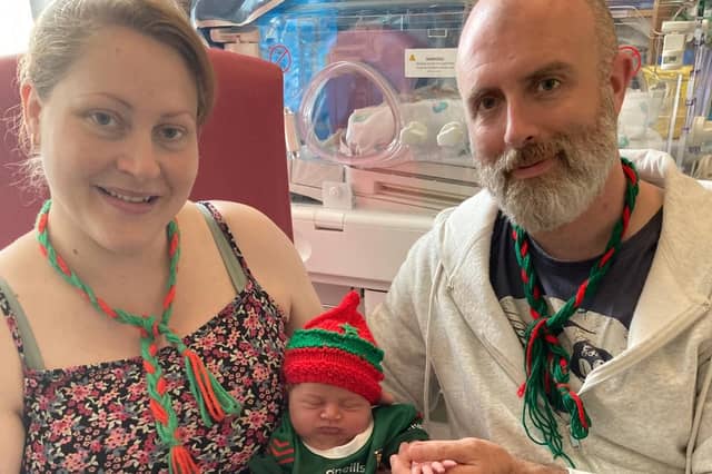 Proud parents Cecelia and Damian Birrane, from Ballina, with their newborn daughter, Eve Samantha, wearing a Mayo jersey.