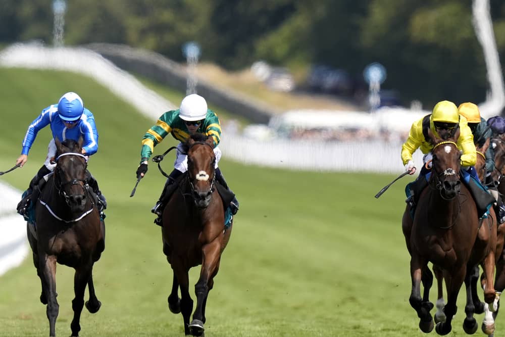 Goodie Two Shoes (centre) gets the better of Santorini Star (left)
