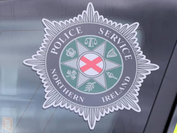 PSNI badge in police car window