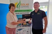Anthony Holohan, Managing Director Solar Compare, presenting Sponsorship Cheque to Patricia Griffin, Secretary of Ballinamore Athletic Club