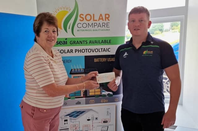 Anthony Holohan, Managing Director Solar Compare, presenting Sponsorship Cheque to Patricia Griffin, Secretary of Ballinamore Athletic Club