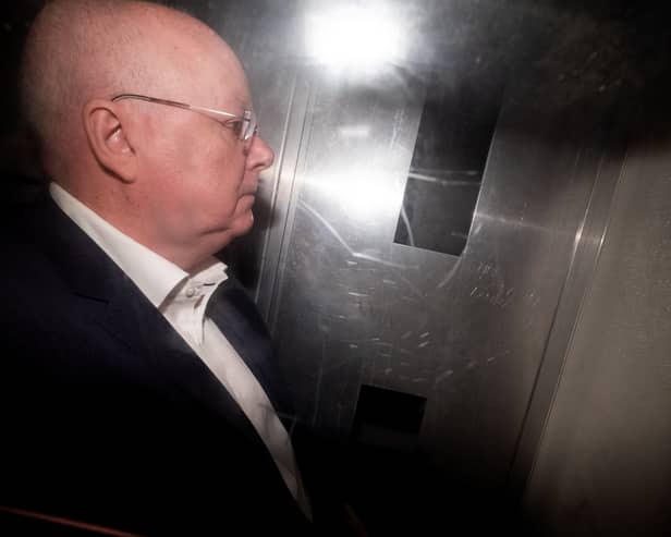 Peter Murrell in the back of a prison van