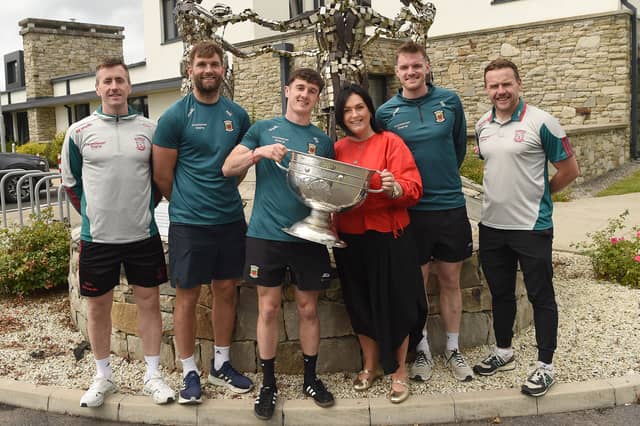 Sam Maguire Cup visits The Mayo Roscommon Hospice From left: Cillian O'Connor, Aidan O'Shea, Jack Coyne, CEO of Mayo Roscommon Hospice Martina Jennings, Matthew Ruane and Mayo team manager Andy Moran. Pic: Conor McKeown