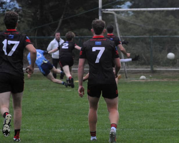 A partially hidden Daire McCabe scores Allen Gaels third goal against Fenagh St Caillins Picture: Willie Donnellan
