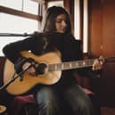 Muireann Bradley performing in a historic passenger coach