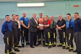 Pictured is Robert McDermott resenting a cheque to Edenderry Fire Brigade 