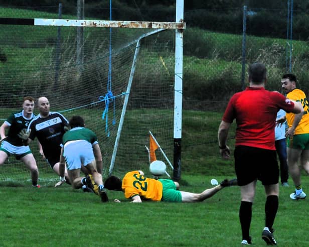 Ballinamore's Tom Prior hits the deck just before Dean McGovern scores his team's first goal Picture: Willie Donnellan
