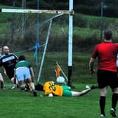Ballinamore's Tom Prior hits the deck just before Dean McGovern scores his team's first goal Picture: Willie Donnellan