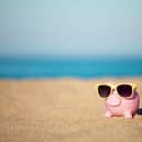 A piggy bank on a beach