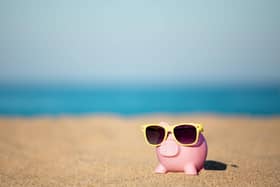 A piggy bank on a beach
