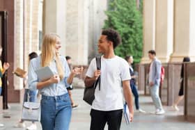 Two university students walking around campus