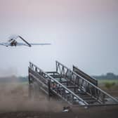 A long-range strike drone takes off from a mobile launcher