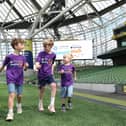 Louis, George and Josh McConnell at the launch of the 2026 Alzheimer's Memory Walk, supported by Aviva Ireland