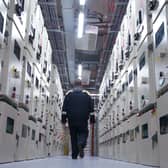 A man walking through a large data centre