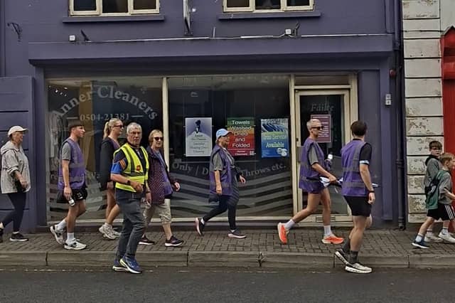 The walkers on the final stretch to Semple Stadium