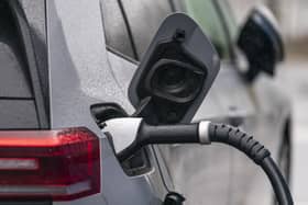 A car charger plugged in to a car