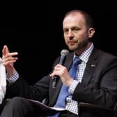 Stephen Gethins speaking with a microphone