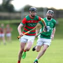 Dylan Hutchinson of Wolfe Tones is pursued by David Gregg (Clonguish Gaels) during Saturday's Cablecomm Senior Hurling Championship Round 3 clash at Michael Fay Park. Wolfe Tones triumphed by 4-20 to 1-10 to book their place in the county final on September 6 against Longford Slashers 