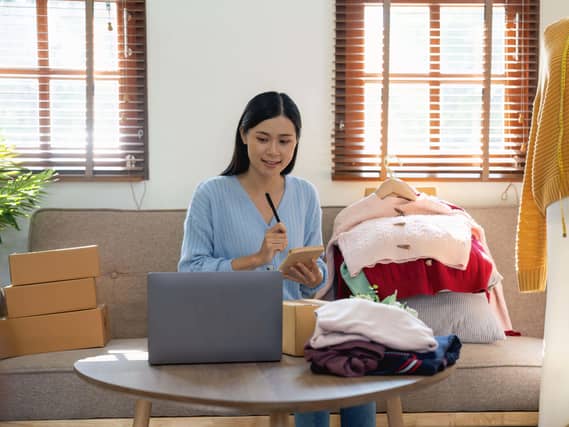 A person selling clothes online