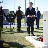 Andy Burnham lays flowers at a grave in Kyiv's national military cemetery