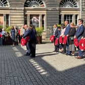 Officials laying wreaths in Edinburgh