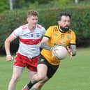 David Reilly on the attack for Cuchulainn Gaels as he gets away from Dylan McArdle Annaghminnon Rovers in the DKIT Junior Championship game in the Ramparts