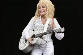 Dolly Parton performing on the Pyramid Stage at the Glastonbury Festival, at Worthy Farm in Somerset.