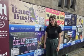 Actress Hannah Richards next to some posters