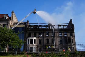 Firefighters pouring water onto building in Princes Street