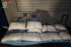 Bags of drugs in evidence bags on a table