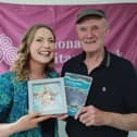 Aedín Ní Thiarnaigh who researched and wrote the booklet making a presentation to Taimín Meachair for his contributions. 