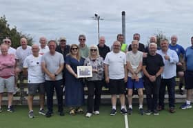 Jillian and Louise, daughters of the late George Guest, with a framed photo of his last meet-up with his old Galway United friends. They are pictured with (front - from left) Gerry Fallon, Jimmy Nolan, Derek Rodgers, Stephen Lally, John Mannion, former Shamrock Rovers player and manager Pat Byrne, Gerry Daly and Mike O’Toole, with (back) Peadar Ryan, Kevin Farrelly, Joe Keating, former Bohs goalkeeper Dermot O’Neill, former Shamrock Rovers goalkeeper Alan O’Neill, Dave O’Connell, Terry O’Regan, Johnny Glynn, Tony Mannion and Gordon Brett. 
