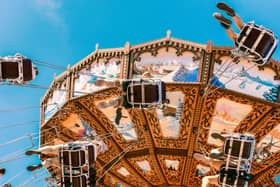 Visitors enjoying amusement rides at Liseberg amusement park in Gothenburg, Sweden.