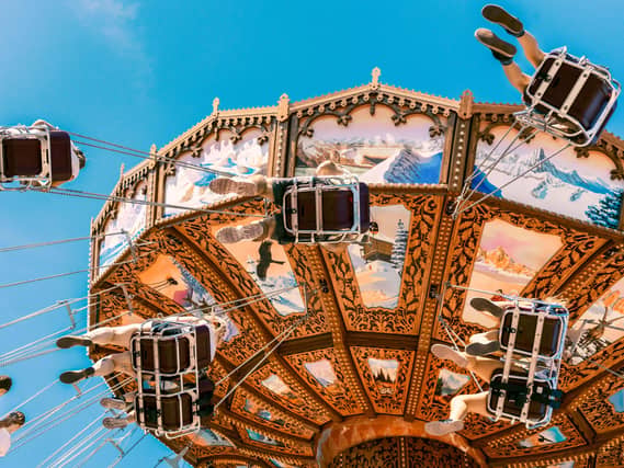 Visitors enjoying amusement rides at Liseberg amusement park in Gothenburg, Sweden.
