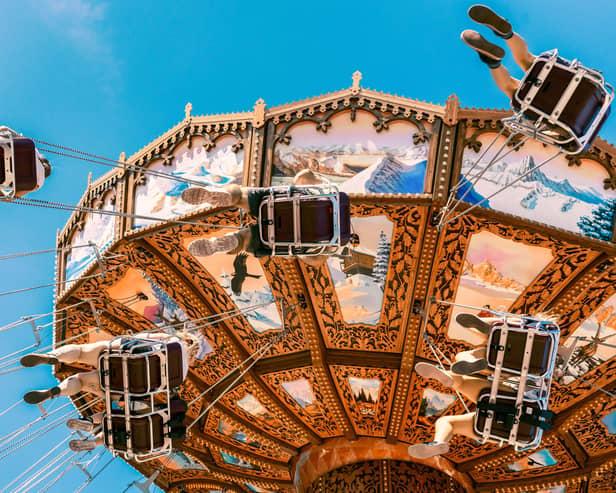 Visitors enjoying amusement rides at Liseberg amusement park in Gothenburg, Sweden.
