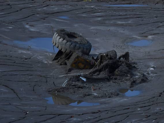 A lorry submerged in mud